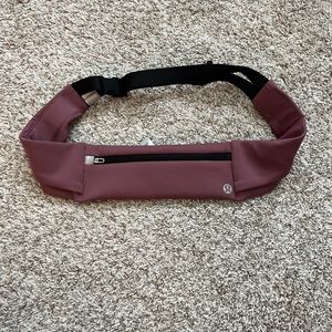 Lululemon running belt bag in a dark pink color in good condition